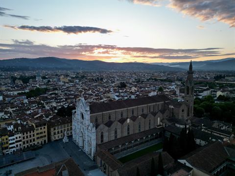 Aerial of the Basilica of Santa Croce and the Florence cityscape in evening light