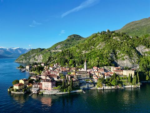Aerial of Varenna's lakeside village jutting into Lake Como