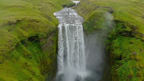 Aerial view over the brink of Skógafoss waterfall in Iceland