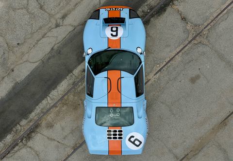 Top-down aerial view of a Gulf-livery Ford GT40, light blue with an orange stripe